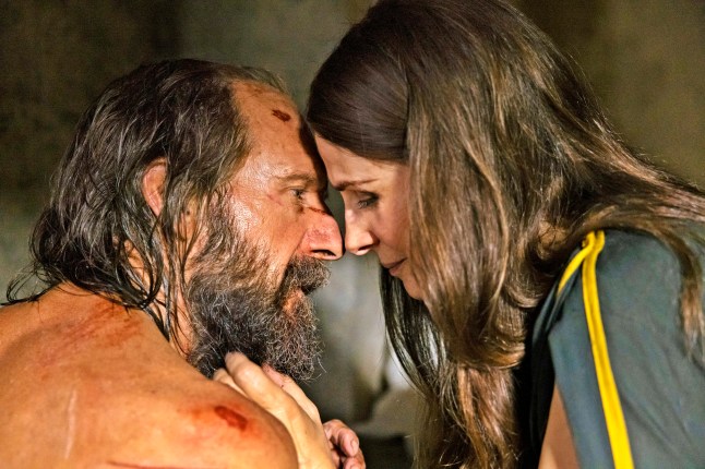 Ralph Fiennes (Odysseus) and Juliette Binoche (Penelope) touch foreheads as they reconcile in a scene from The Return