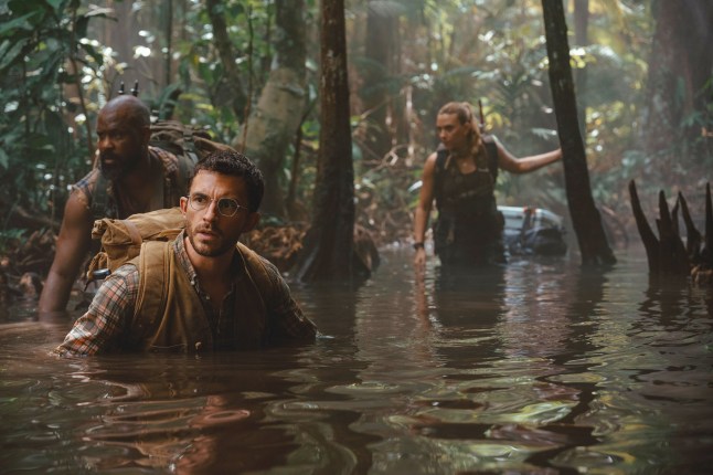 This image released by Universal Pictures and Amblin Entertainment shows, from left, Bechir Sylvain, Jonathan Bailey, and Scarlett Johansson in a scene from