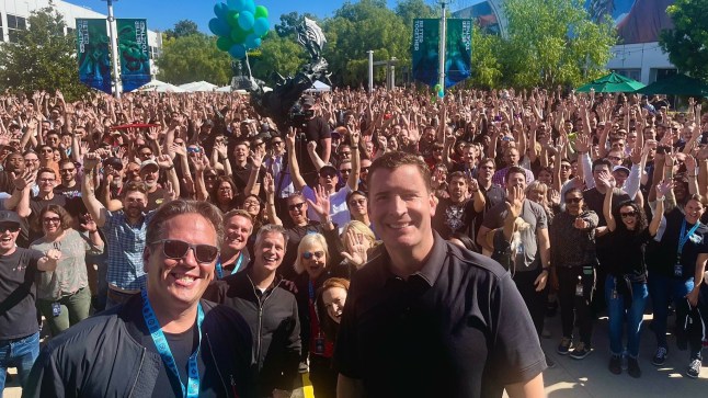 Phil Spencer and Mike Ybarra standing in front of hundreds of Blizzard developers